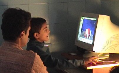 Alok Mahendroo teaching computer to child